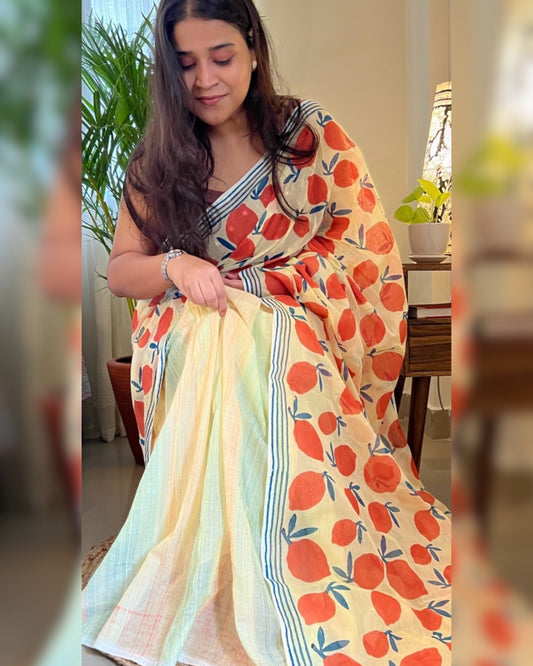 Soft & Comfortable off white mulmul saree with handblock print in orange and yellow mango aam pattern