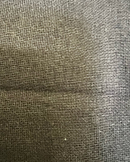 Close-up of textured fabric with a visible seam