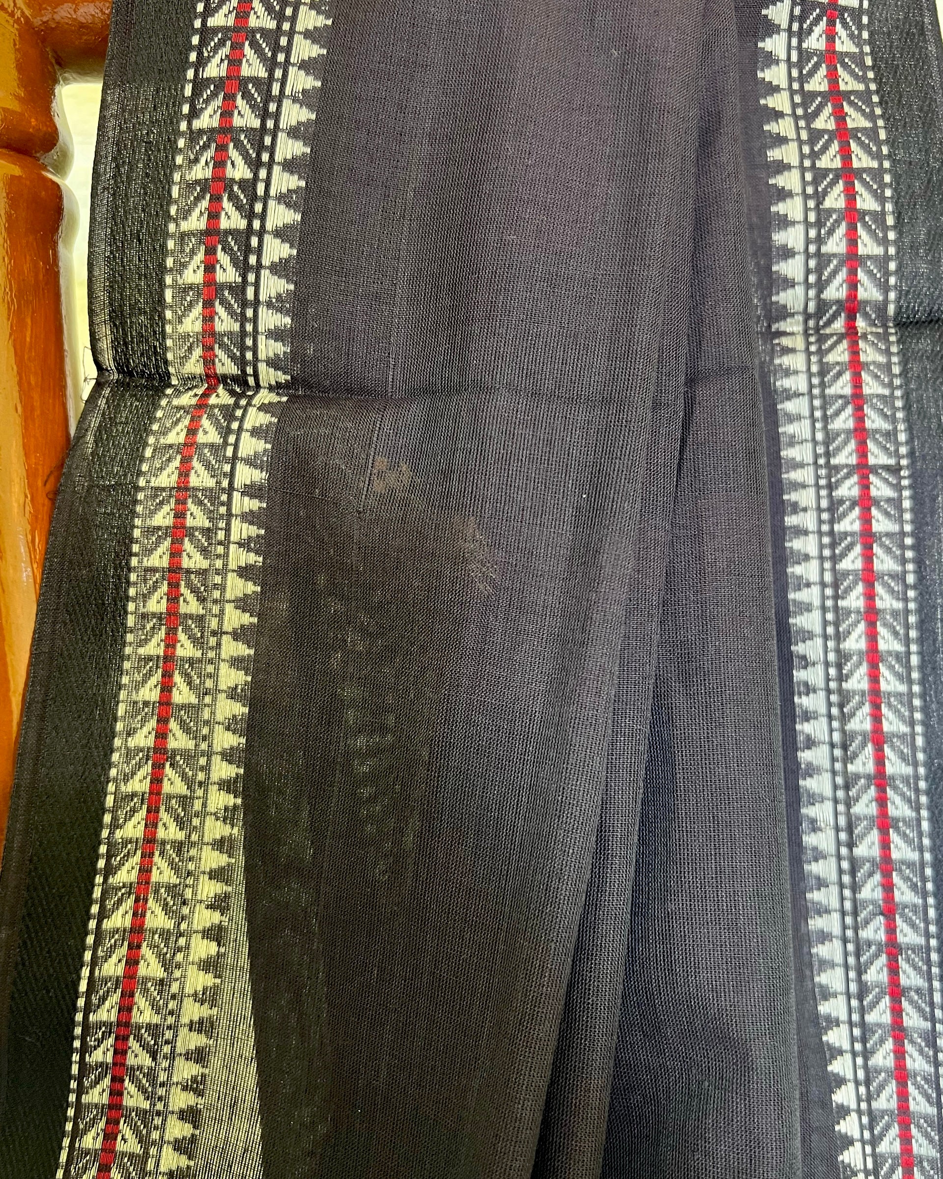Dark gray khadi cotton fabric with red and white patterned border