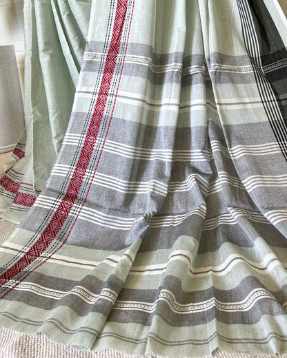 Striped khadi cotton saree with red, gray, and white pattern on a light background