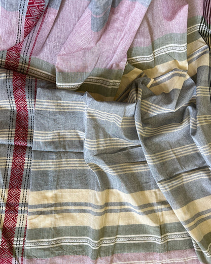 Close-up of pink khadi cotton saree with red, pink, gray, and beige colors.