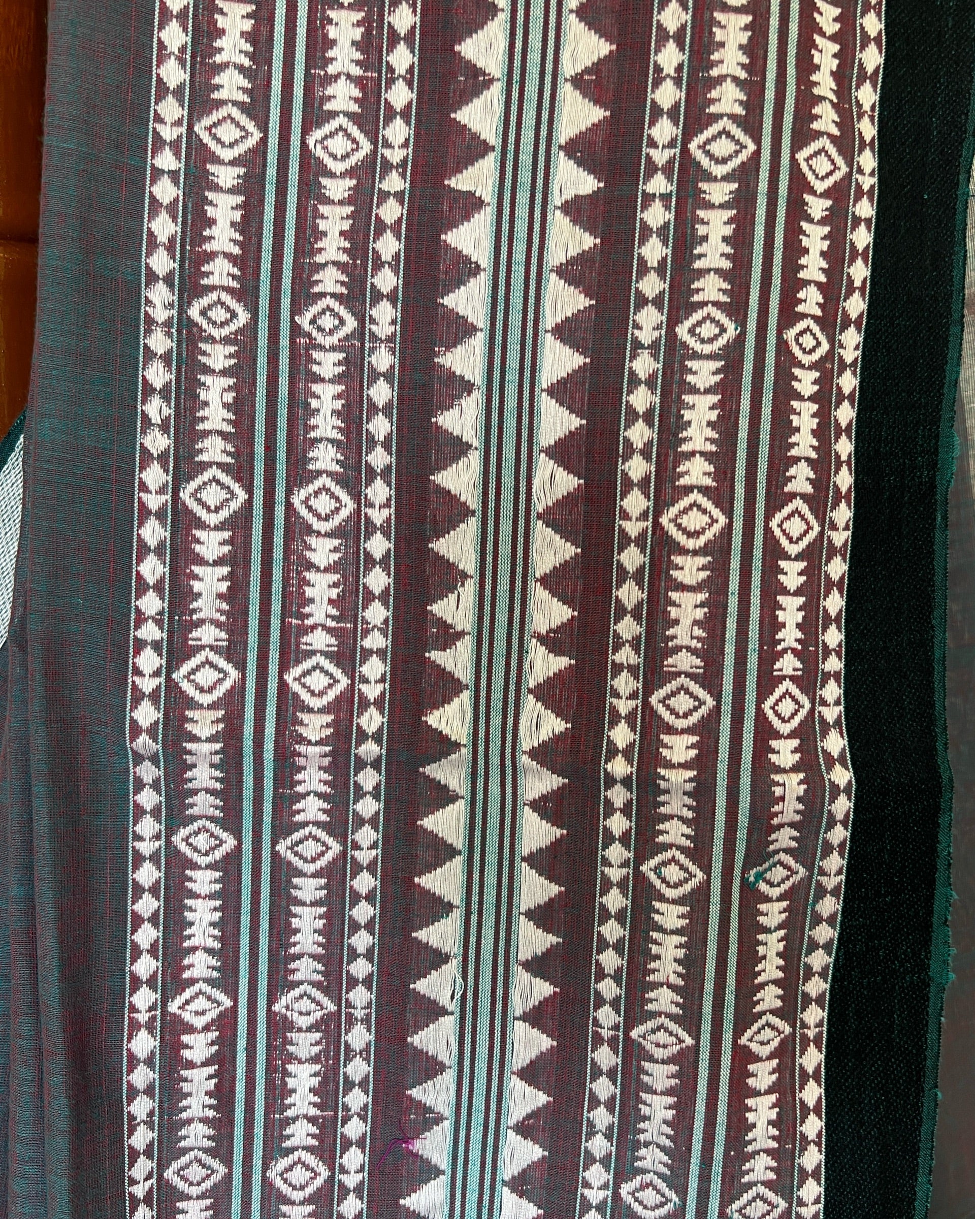 Detailed view of Meghbarna traditional teal Bengal handloom cotton saree featuring artisanal weave patterns