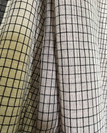 Close-up of brown checkered saree by Shopaame