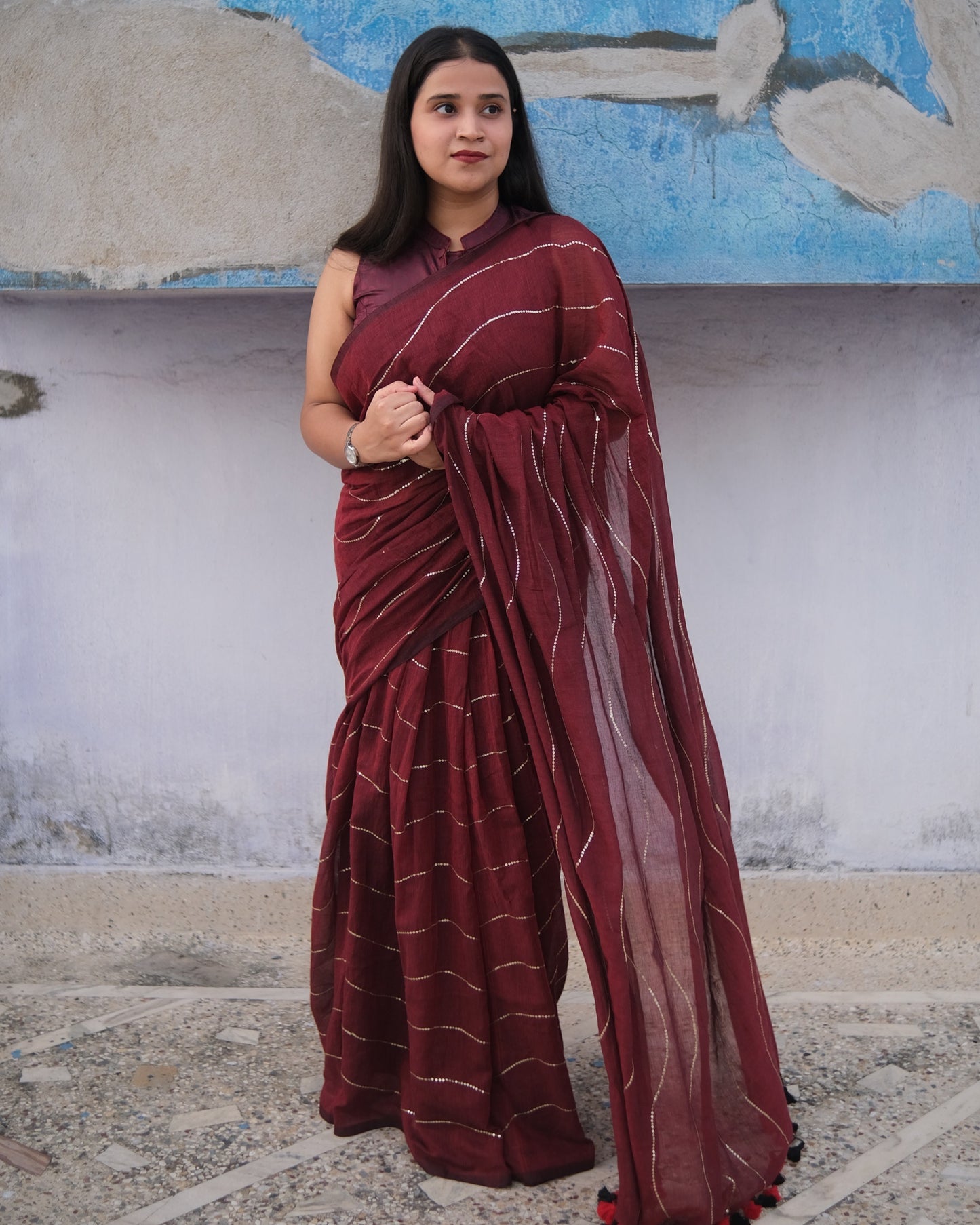 Soft and Comfortable mulmul cotton saree in maroon red shade with sequin emblishment for festive or party wear at reasonable price