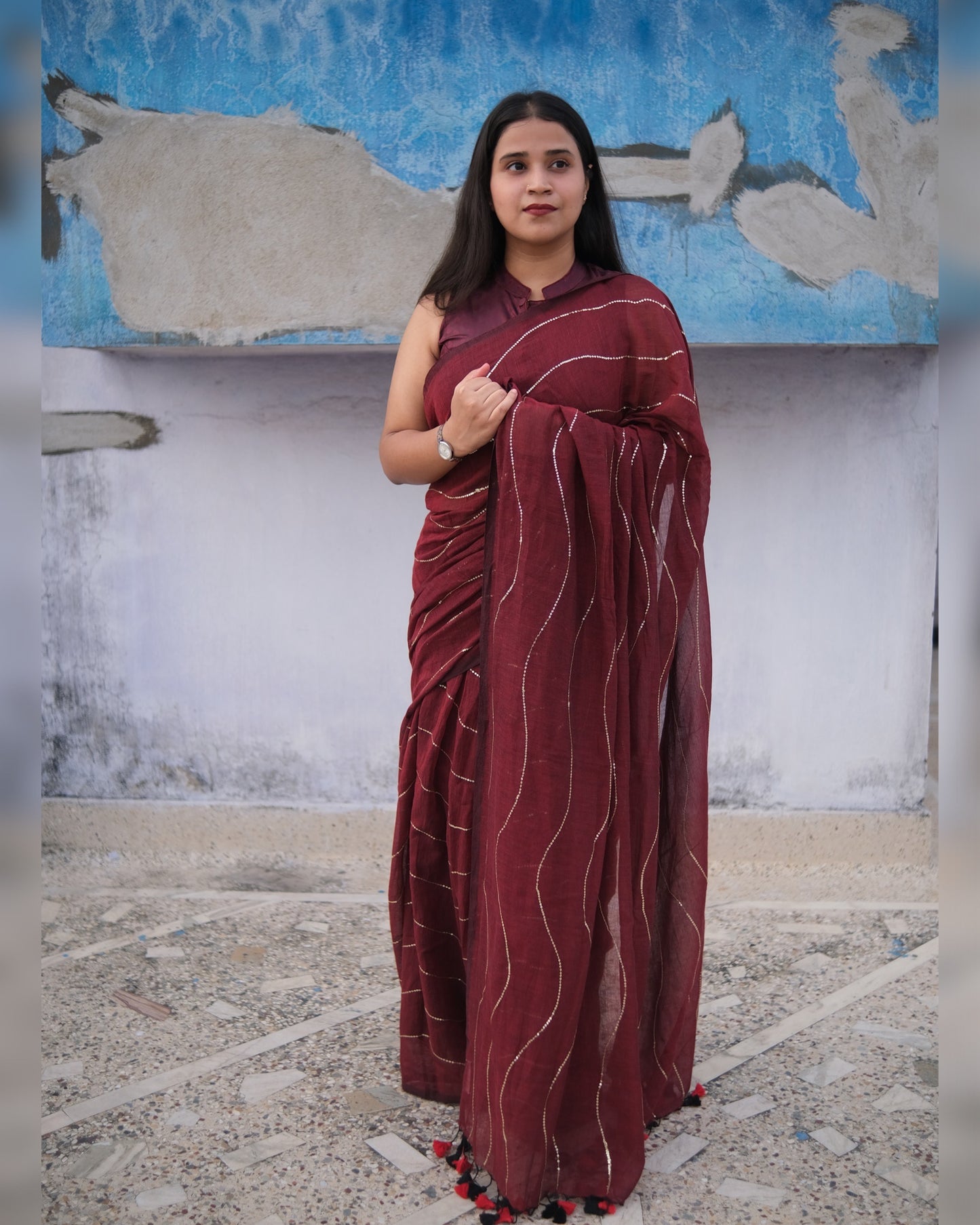 Soft and Comfortable mulmul cotton saree in maroon red shade with sequin emblishment for festive or party wear at reasonable price