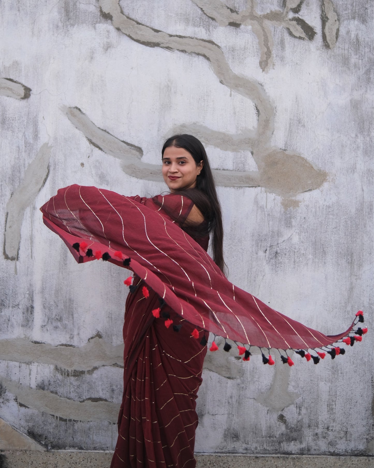 Soft and Comfortable mulmul cotton saree in maroon red shade with sequin emblishment for festive or party wear at reasonable price