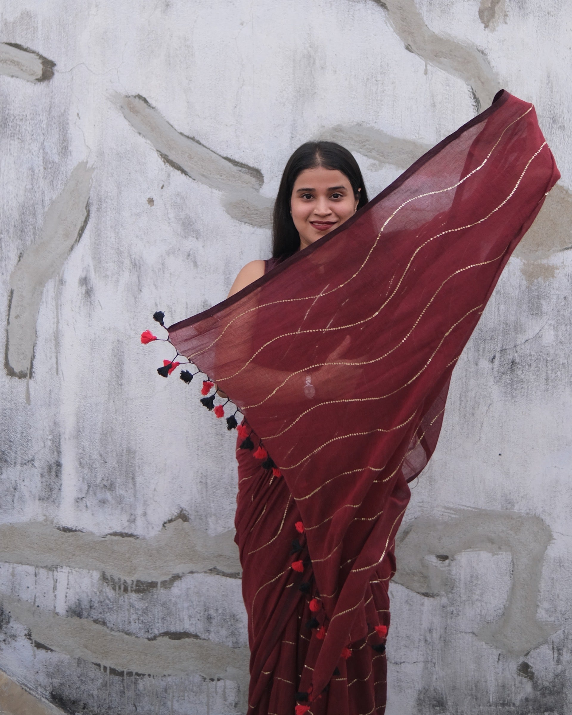 Soft and Comfortable mulmul cotton saree in maroon red shade with sequin emblishment for festive or party wear at reasonable price