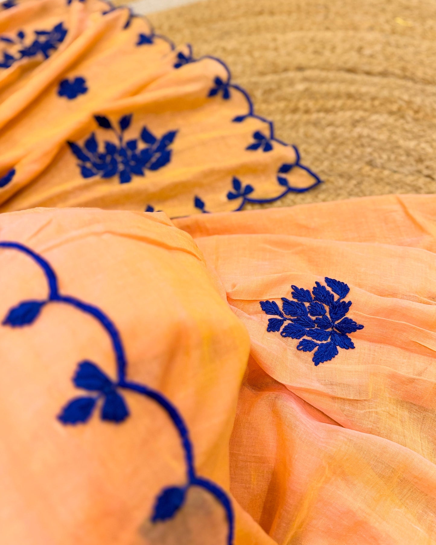 Amber Azure (Peach Hand Embroidered Mulmul Saree)
