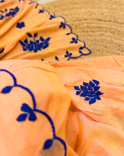 Amber Azure (Peach Hand Embroidered Mulmul Saree)