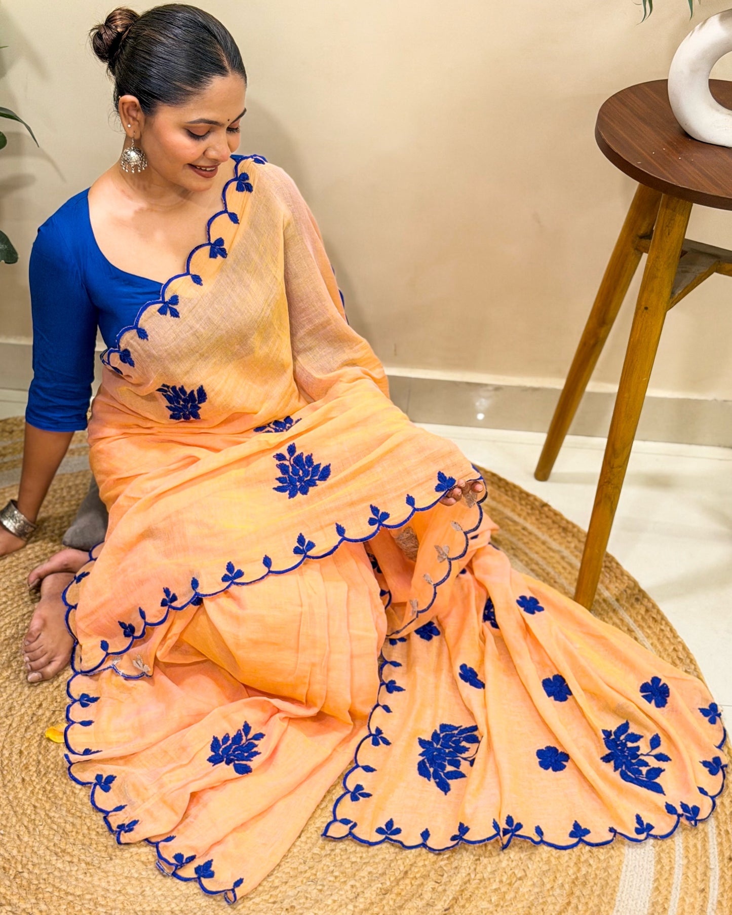 Amber Azure (Peach Hand Embroidered Mulmul Saree)