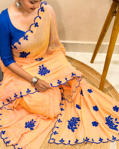 Amber Azure (Peach Hand Embroidered Mulmul Saree)