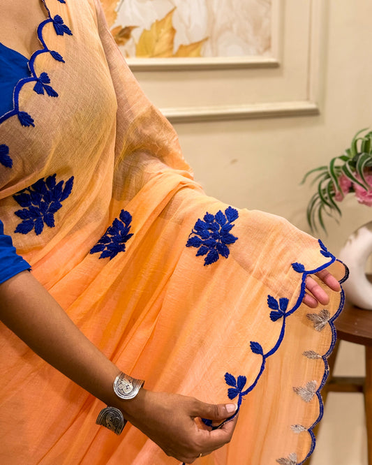 Amber Azure (Peach Embroidered Mulmul Saree)