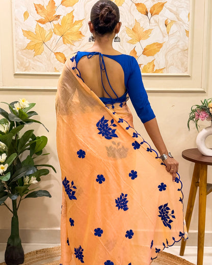 Amber Azure (Peach Hand Embroidered Mulmul Saree)