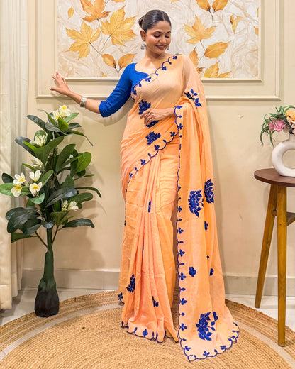 Amber Azure (Peach Hand Embroidered Mulmul Saree)