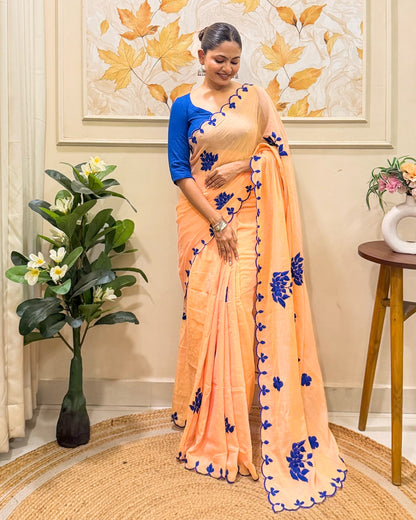 Amber Azure (Peach Hand Embroidered Mulmul Saree)