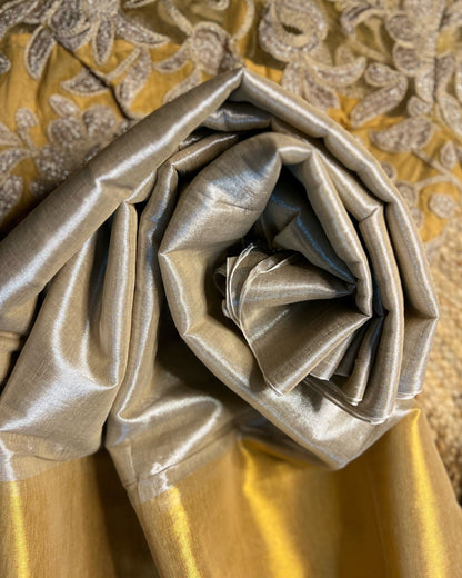 Viral Comfortable tissue saree in metallic golden and silver tones for festive or party wear at reasonable price