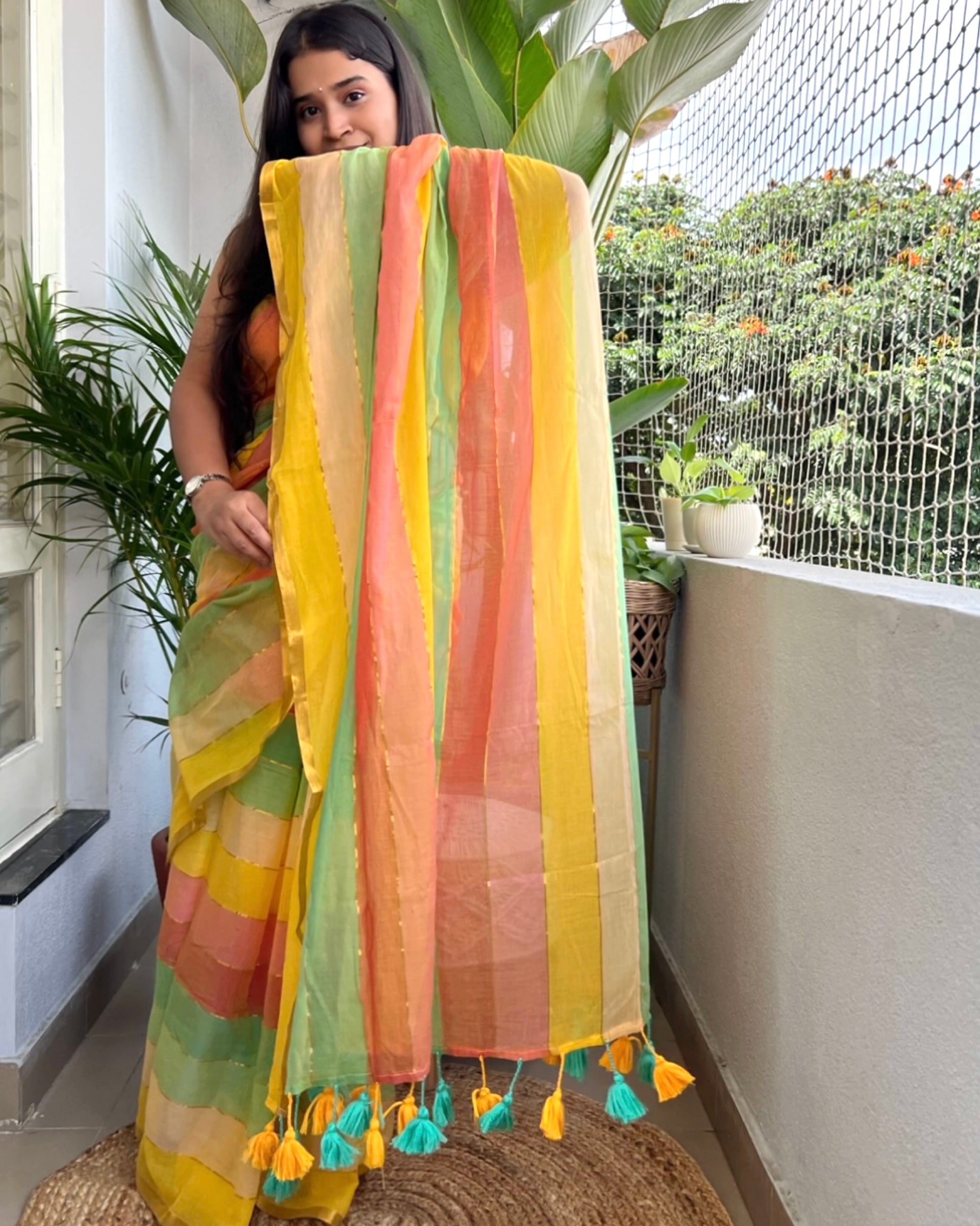 Multicolored striped soft and comfortable mulmul cotton saree for summer with golden zari detailing and paries