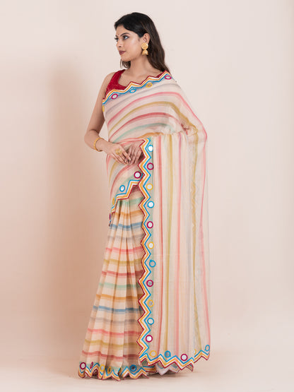 Lightweight peach mulmul cotton saree with mirror embroidery and multicolored stripes. Perfect for summer wear, festive looks, and effortless elegance.