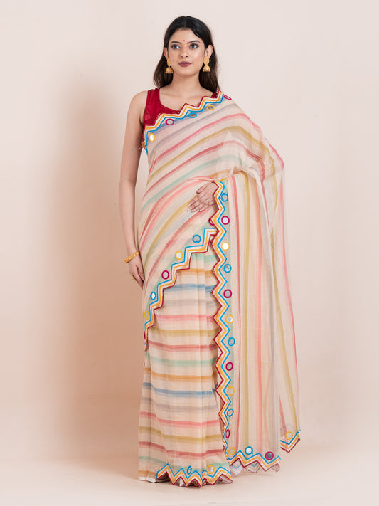 Lightweight peach mulmul cotton saree with mirror embroidery and multicolored stripes. Perfect for summer wear, festive looks, and effortless elegance.