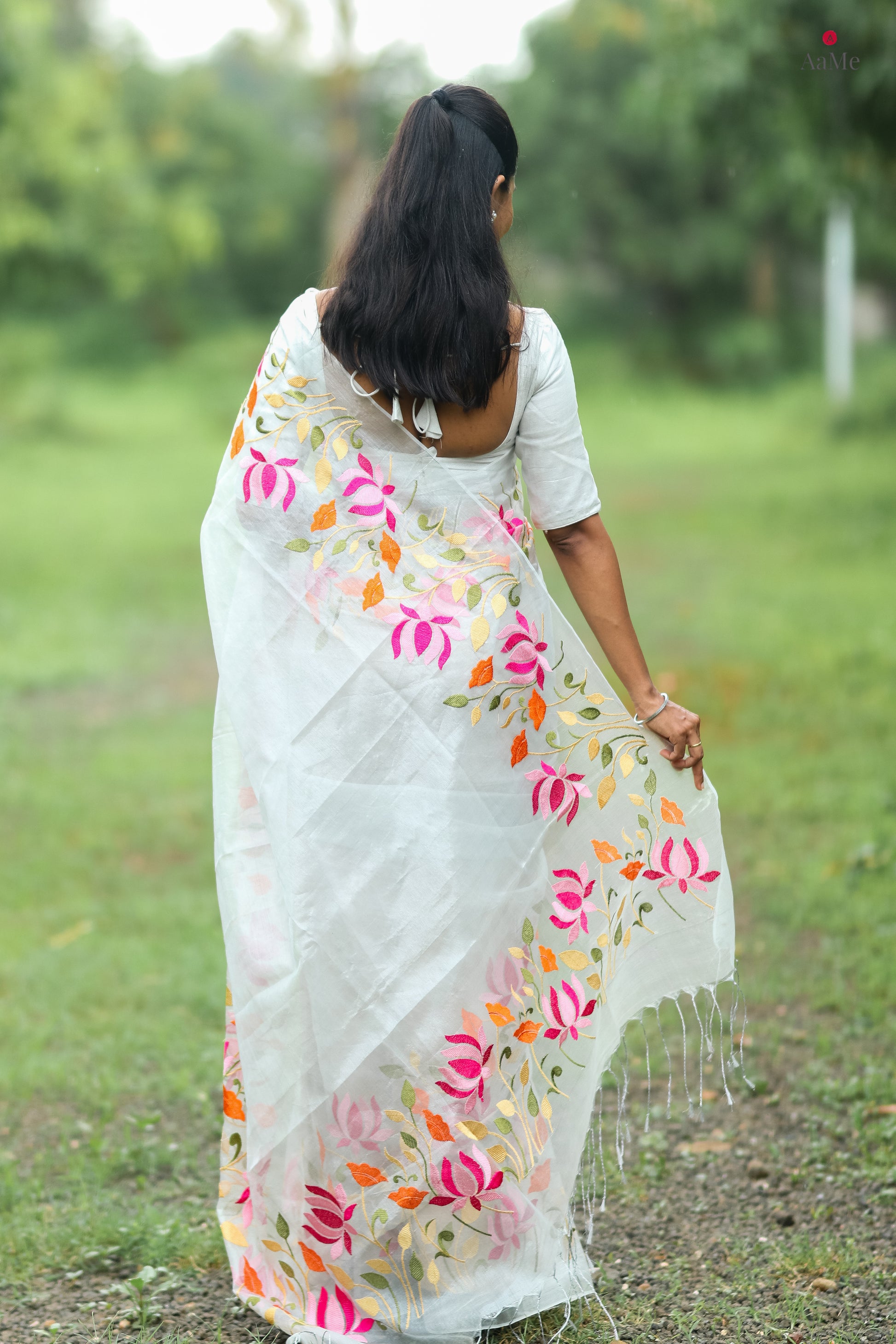 Silver white viral  tissue saree with floral embroidery orange and pink