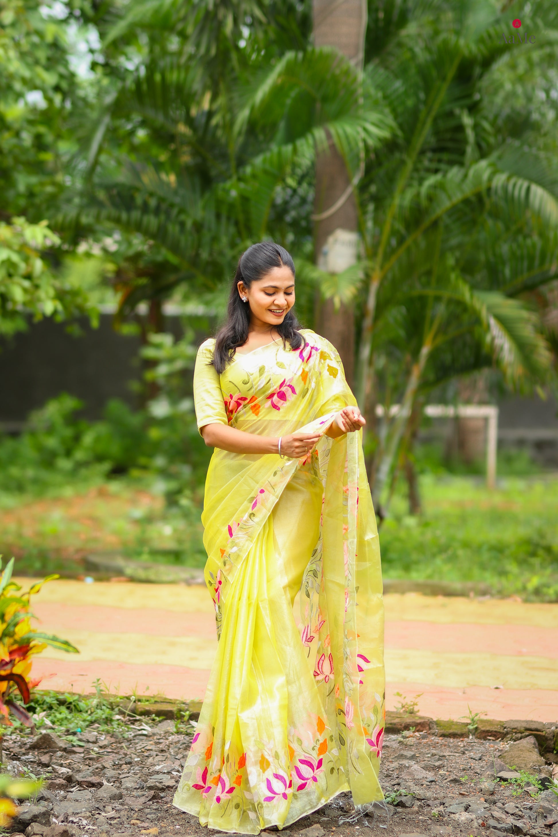 Yellow viral  tissue saree with floral embroidery orange and pink